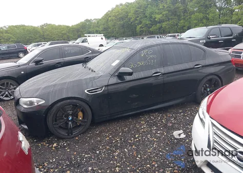 2015 BMW M5 z USA, uszkodzony, nr VIN WBSFV9C52FD595287